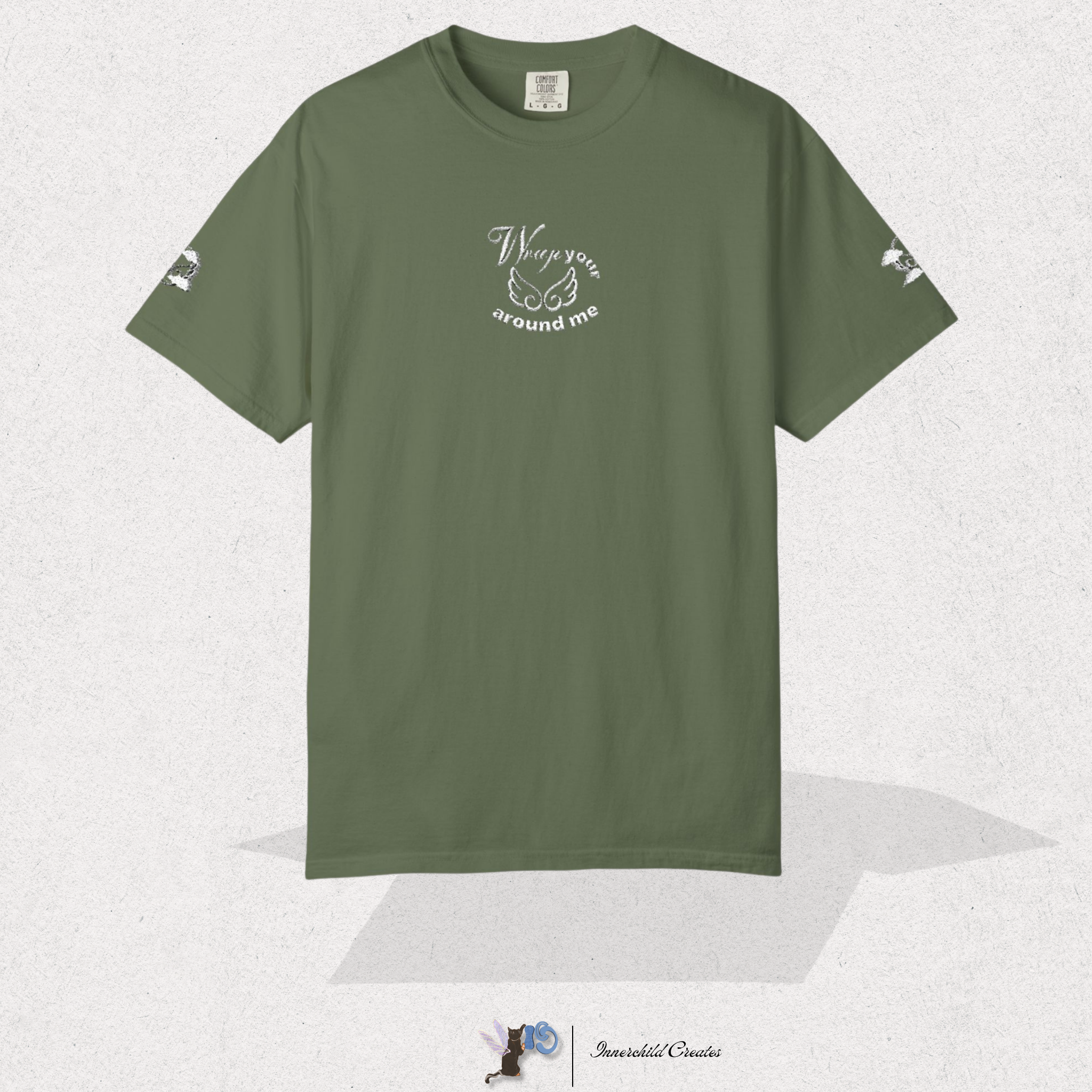 Green t-shirt with text and bird designs on a white background